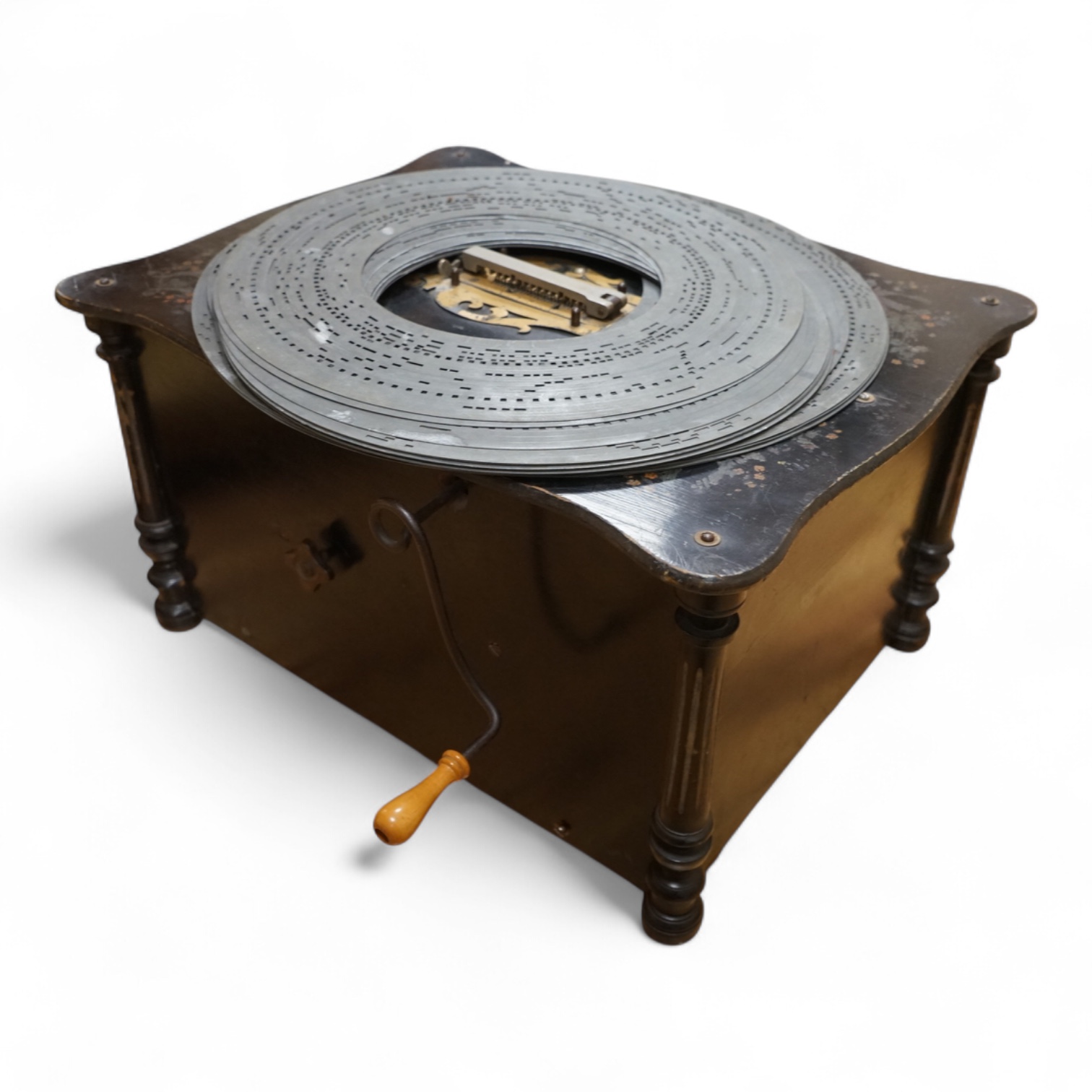 An early 20th century Organette Phoenix in an ebonised case, together with a selection of nineteen related and unrelated discs in three different sizes; five 37cm diameter discs, three 33.3cm diameter discs and eleven 31